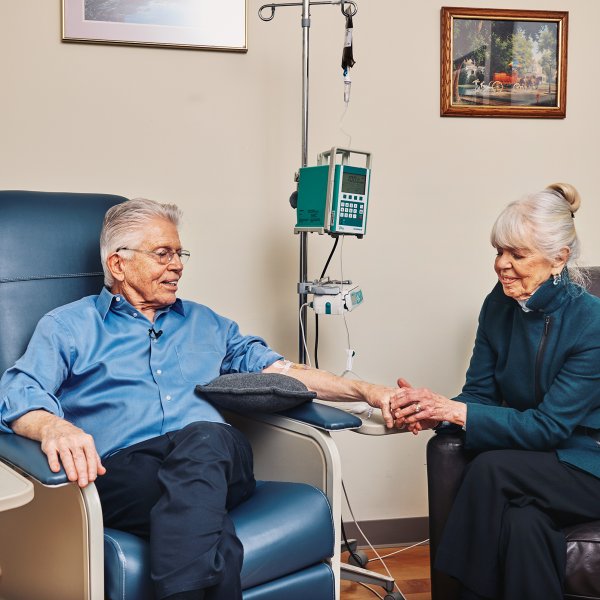 Peter Wooding, with his his wife JoAnn, receiving an infusion of the experimental Alzheimer's drug aducanumab in 2017.